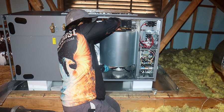 Service technician replacing part in heater