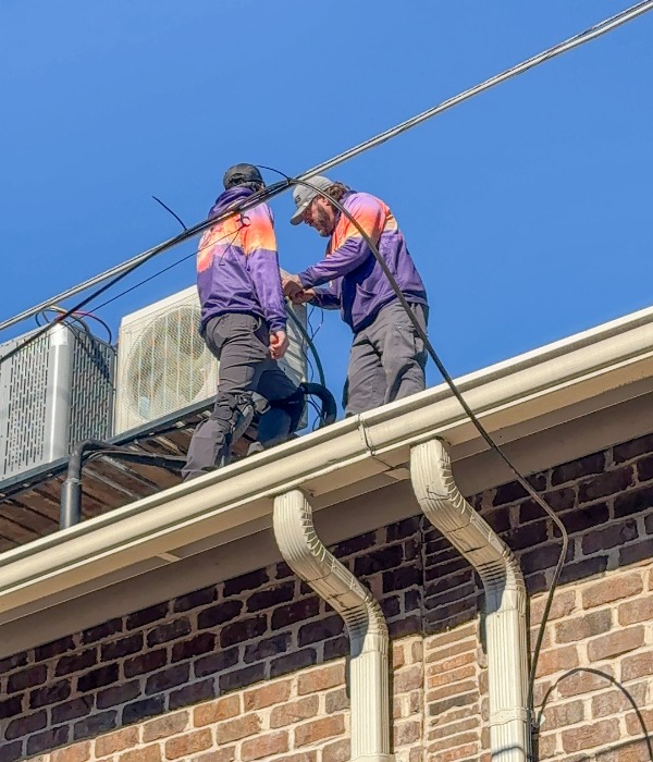 Old Coast Techs Installing Hvac Units On Roof (1)